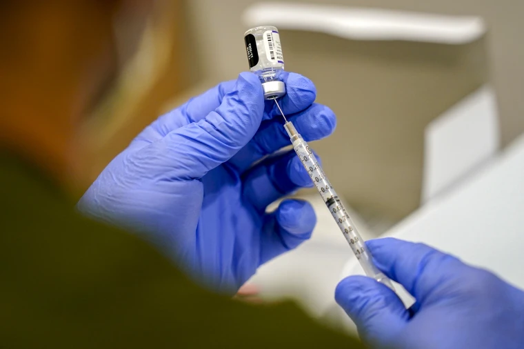 U.S. FDA approves updated COVID shots with new restrictions