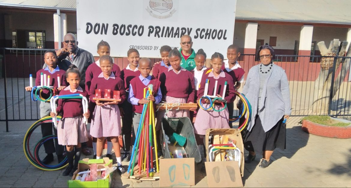 Businessman donates sports equipment to two schools
