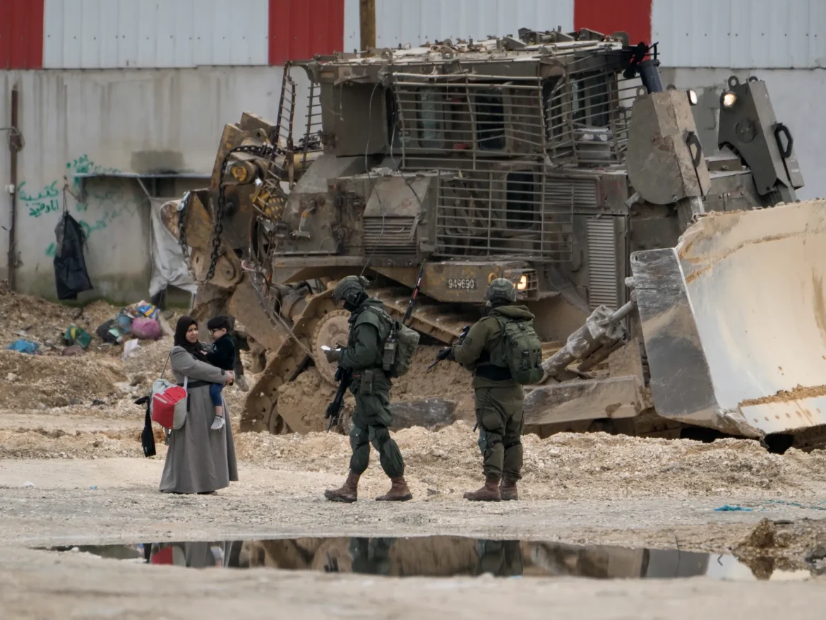 Israeli army shuts down charity headquarters, demolishes sports field in West Bank: sources